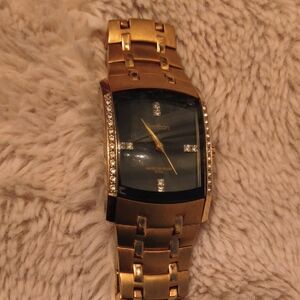 Armitron Gold Watch with Black Dial and Crystal Details